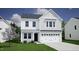 Two-story house, white siding, gray roof, and black garage door at 75 Calabria Ct, Franklinton, NC 27525