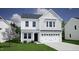 Two-story home with gray roof, white siding, and a two-car garage at 75 Calabria Ct, Franklinton, NC 27525