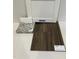 Luxury vinyl plank flooring and granite countertop samples displayed at 75 Calabria Ct, Franklinton, NC 27525