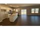 Modern kitchen featuring a large island, stainless steel appliances, and an open layout to the living space at 75 Calabria Ct, Franklinton, NC 27525