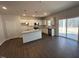 Bright kitchen boasts granite counters, stainless appliances, a center island, and an open layout at 75 Calabria Ct, Franklinton, NC 27525
