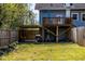 Backyard with deck, patio, and fenced yard at 807 E Edenton St, Raleigh, NC 27601