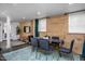 Spacious basement dining area with wood wall and large windows at 807 E Edenton St, Raleigh, NC 27601
