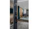 Modern basement apartment entry with keyless entry and wood-paneled accent wall at 807 E Edenton St, Raleigh, NC 27601