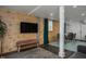 Basement living area with TV, wood wall, and colorful bench at 807 E Edenton St, Raleigh, NC 27601