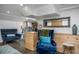 Relaxing basement sitting area with comfy armchairs and wood feature wall at 807 E Edenton St, Raleigh, NC 27601