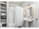 Clean bathroom with a pedestal sink and built-in shelving at 807 E Edenton St, Raleigh, NC 27601