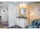 Basement bathroom with concrete floor, floating vanity, and wood-paneled accent wall at 807 E Edenton St, Raleigh, NC 27601