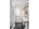 Bathroom with double vanity, subway tile shower, and modern light fixtures at 807 E Edenton St, Raleigh, NC 27601