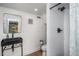 Clean bathroom with a walk-in shower, toilet and pedestal sink at 807 E Edenton St, Raleigh, NC 27601