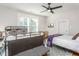 Spacious bedroom with two beds, large windows, and ceiling fan at 807 E Edenton St, Raleigh, NC 27601