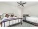Bedroom with king and twin bed, ceiling fan, and geometric rug at 807 E Edenton St, Raleigh, NC 27601