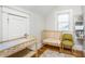 Bedroom with crib, changing table, and storage shelving at 807 E Edenton St, Raleigh, NC 27601