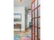 Entryway with colorful rug, console table, and view into another room at 807 E Edenton St, Raleigh, NC 27601