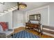 Elegant entryway with hardwood floors, statement furniture, and a staircase at 807 E Edenton St, Raleigh, NC 27601