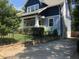Side view showcasing the home's architectural details and driveway at 807 E Edenton St, Raleigh, NC 27601