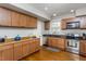 Modern kitchen with stainless steel appliances and hardwood floors at 807 E Edenton St, Raleigh, NC 27601