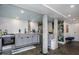 Basement kitchen features gray cabinets, stainless steel appliances, and concrete floors at 807 E Edenton St, Raleigh, NC 27601