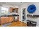Updated kitchen with stainless steel appliances and laundry area at 807 E Edenton St, Raleigh, NC 27601