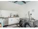 Bright laundry room with white cabinets and new appliances at 807 E Edenton St, Raleigh, NC 27601