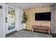 Basement living area with wood-paneled wall, flat-screen TV, and comfortable seating at 807 E Edenton St, Raleigh, NC 27601