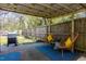 Relaxing patio area with wicker chairs and blue rug at 807 E Edenton St, Raleigh, NC 27601