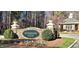 The Governor's Club stone entrance sign is surrounded by manicured landscaping and mature trees at 81002 Alexander, Chapel Hill, NC 27517