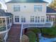 Back exterior featuring a deck, screened porch, and well-maintained landscaping at 81002 Alexander, Chapel Hill, NC 27517