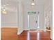 Bright foyer featuring hardwood floors, a chandelier, and a white front door with sidelights at 81002 Alexander, Chapel Hill, NC 27517