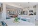 Open concept dining area with white table and chairs, overlooking the kitchen at 90 Clementine Street St # 176, Angier, NC 27501