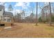 House backyard with large open space at 99 Prairie Dog Dr, Louisburg, NC 27549