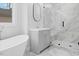 Modern bathroom with gray vanity, a large shower, and marble floors at 99 Prairie Dog Dr, Louisburg, NC 27549