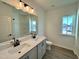 Bathroom boasts double vanity, a bathtub, and a window at 100 S Stonemill Trl # Homesite 234, Clayton, NC 27520