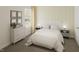 Bedroom with a striped comforter and yellow accent wall at 100 S Stonemill Trl # Homesite 234, Clayton, NC 27520