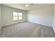 Bright bedroom with carpet flooring and large windows at 100 S Stonemill Trl # Homesite 234, Clayton, NC 27520