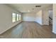 Bright and airy living room with hardwood-style floors at 100 S Stonemill Trl # Homesite 234, Clayton, NC 27520