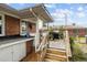 Wooden deck with steps and brick wall at 105 W Ivey St, Lillington, NC 27546