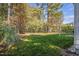 Wooded backyard with grassy area at 106 Skygrove Dr, Clayton, NC 27527