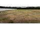 Large backyard featuring a new white fence and views of the surrounding trees at 107 Pretty Run Branch Ln, Wendell, NC 27591