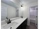 Bathroom vanity with double sinks, quartz countertops, and black fixtures at 107 Pretty Run Branch Ln, Wendell, NC 27591