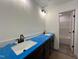 Modern bathroom features a dual vanity with dark cabinets and a doorway to a tub at 107 Pretty Run Branch Ln, Wendell, NC 27591