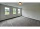 Bright bedroom with carpeted floors and natural light from the windows at 107 Pretty Run Branch Ln, Wendell, NC 27591