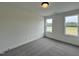 Bright bedroom with carpeted floors and natural light from the windows at 107 Pretty Run Branch Ln, Wendell, NC 27591