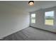 Bright bedroom with carpeted floors and natural light from the windows at 107 Pretty Run Branch Ln, Wendell, NC 27591