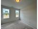 Bright bedroom with two windows allowing for natural light at 107 Pretty Run Branch Ln, Wendell, NC 27591