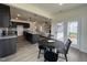 Open concept kitchen and dining area with stainless steel appliances and plenty of natural light at 107 Pretty Run Branch Ln, Wendell, NC 27591