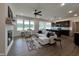 Open-concept living space connects the kitchen and Gathering room with hardwood floors and neutral decor at 107 Pretty Run Branch Ln, Wendell, NC 27591