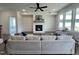 Bright living room with a fireplace, hardwood floors, and large windows offering great views at 107 Pretty Run Branch Ln, Wendell, NC 27591