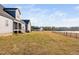 Large backyard with pond views and a privacy fence at 108 Waterfall Dr, Sanford, NC 27330