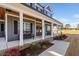 Inviting front porch with wooden ceiling and double front doors at 108 Waterfall Dr, Sanford, NC 27330